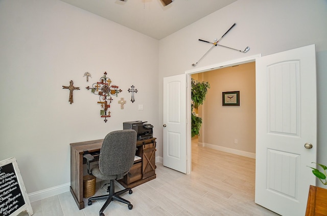 18234 Shoreline Vista Ln, Cypress, TX 77433 - office area with ceiling fan, baseboards, and light wood-style floors