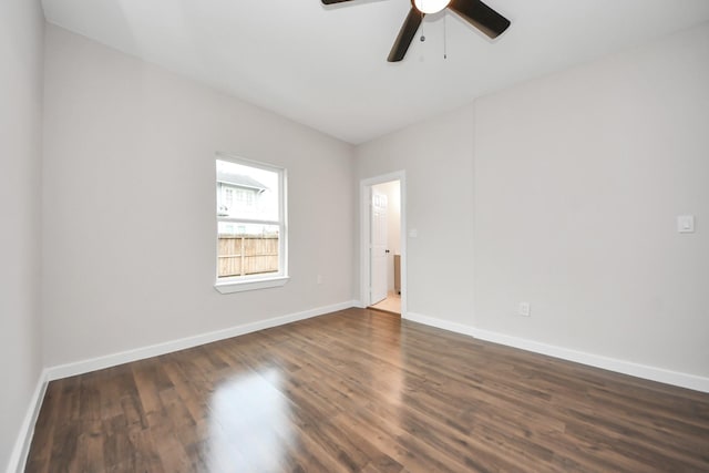 409 S 72nd St, Houston, TX 77011 - spare room featuring ceiling fan, dark wood finished floors, and baseboards