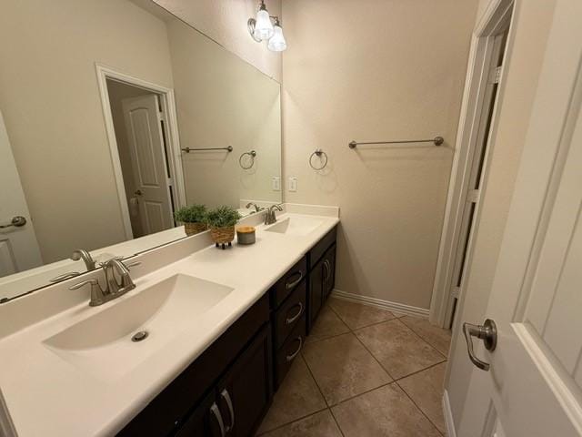 1216 Matthew Hills Ln, Spring, TX 77386 - full bath featuring double vanity, tile patterned flooring, and baseboards