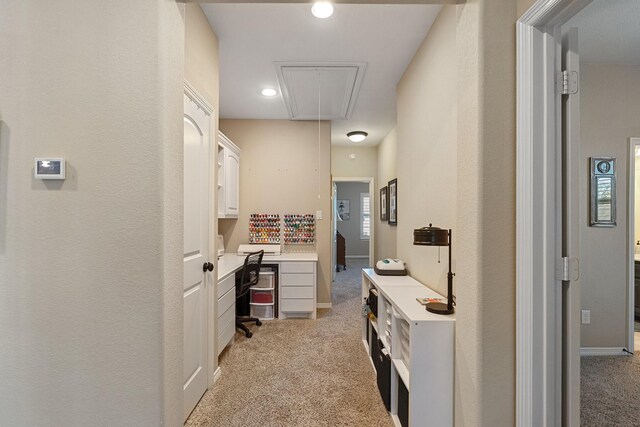 5131 Rowley Falls Ln, Sugar Land, TX 77479 - hallway with attic access, light carpet, a desk, and recessed lighting