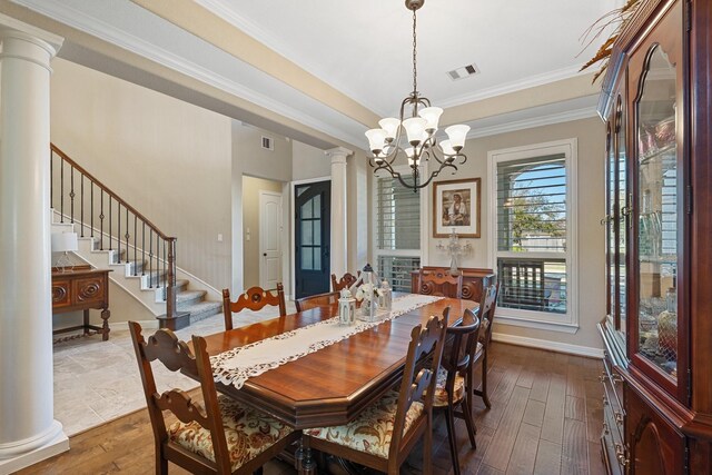 5131 Rowley Falls Ln, Sugar Land, TX 77479 - dining space featuring dark wood-style floors, decorative columns, a chandelier, ornamental molding, and stairway
