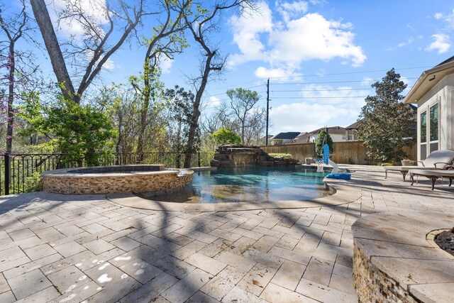 5131 Rowley Falls Ln, Sugar Land, TX 77479 - fenced backyard featuring a pool with connected hot tub and a patio