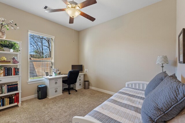 5131 Rowley Falls Ln, Sugar Land, TX 77479 - carpeted bedroom featuring multiple windows, an office area, baseboards, and a ceiling fan