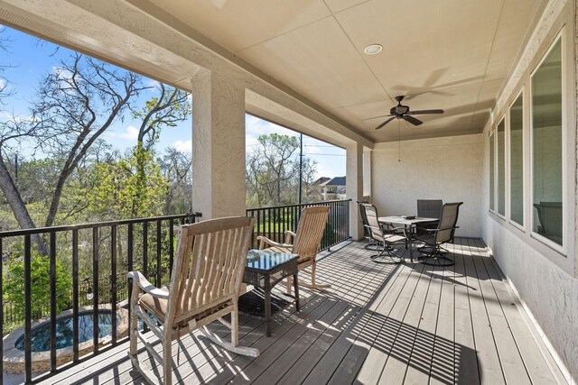 5131 Rowley Falls Ln, Sugar Land, TX 77479 - wooden deck with outdoor dining area and a ceiling fan