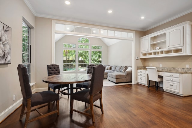 12126 Oak Park Dr, Houston, TX 77070 - dining space with dark wood-style flooring, healthy amount of natural light, recessed lighting, ornamental molding, and baseboards