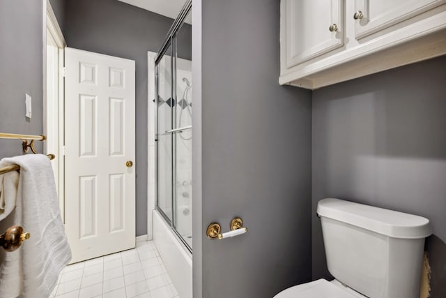 12126 Oak Park Dr, Houston, TX 77070 - full bath featuring tile patterned flooring, toilet, and combined bath / shower with glass door