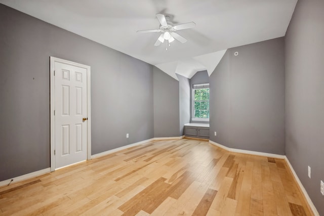 12126 Oak Park Dr, Houston, TX 77070 - spare room featuring a ceiling fan, light wood-style floors, lofted ceiling, and baseboards