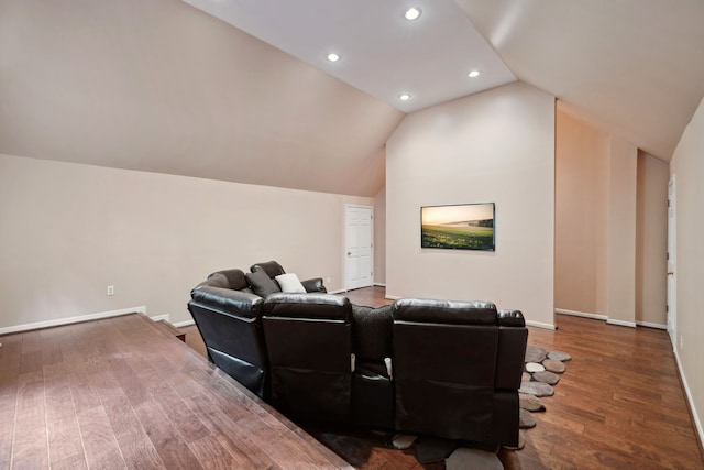 12126 Oak Park Dr, Houston, TX 77070 - home theater featuring wood finished floors, vaulted ceiling, baseboards, and recessed lighting