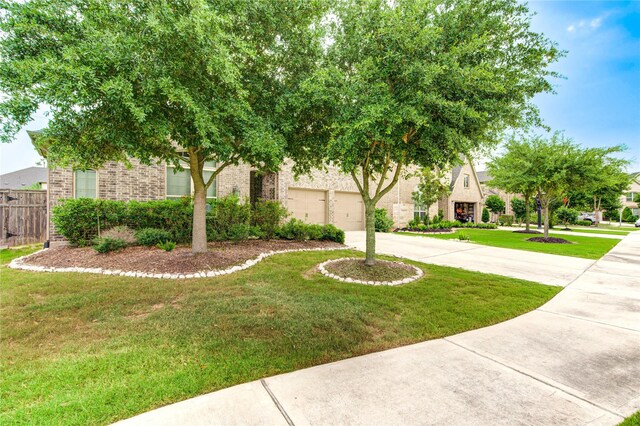 28418 Asher Falls Ln, Fulshear, TX 77441 - view of front of house featuring driveway and brick siding