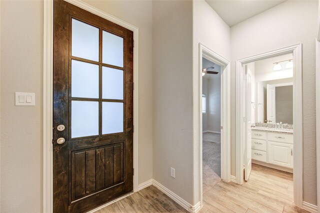 28418 Asher Falls Ln, Fulshear, TX 77441 - foyer with light wood finished floors and baseboards