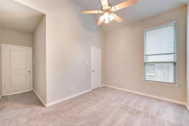 28418 Asher Falls Ln, Fulshear, TX 77441 - spare room with light carpet, vaulted ceiling, ceiling fan, and baseboards