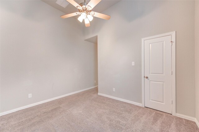 28418 Asher Falls Ln, Fulshear, TX 77441 - spare room with light carpet, ceiling fan, baseboards, and a high ceiling