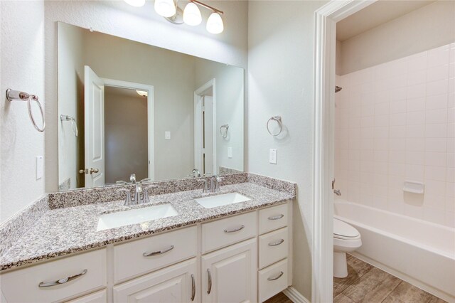 28418 Asher Falls Ln, Fulshear, TX 77441 - full bathroom featuring double vanity, toilet, and washtub / shower combination
