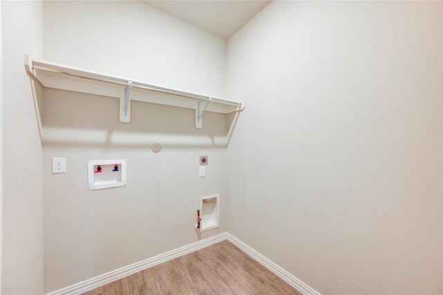 28418 Asher Falls Ln, Fulshear, TX 77441 - laundry area featuring gas dryer hookup, hookup for an electric dryer, light wood-style floors, baseboards, and washer hookup
