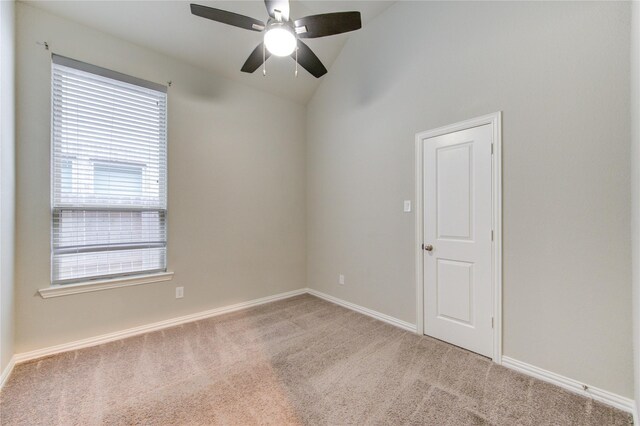 28418 Asher Falls Ln, Fulshear, TX 77441 - spare room featuring carpet flooring, healthy amount of natural light, ceiling fan, vaulted ceiling, and baseboards