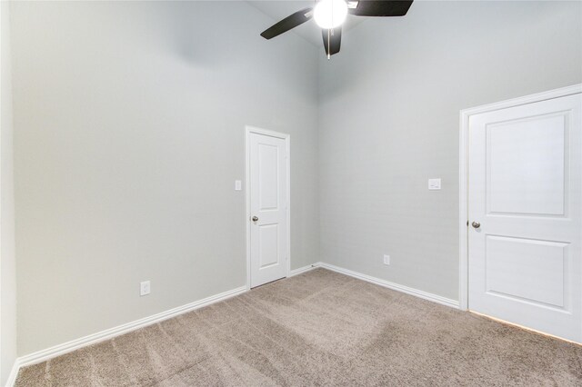 28418 Asher Falls Ln, Fulshear, TX 77441 - carpeted spare room featuring a towering ceiling, a ceiling fan, and baseboards