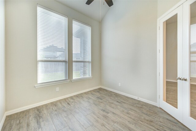 28418 Asher Falls Ln, Fulshear, TX 77441 - spare room with a ceiling fan, light wood-style flooring, baseboards, and lofted ceiling