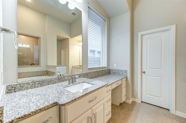 28418 Asher Falls Ln, Fulshear, TX 77441 - full bathroom with vanity, a bath, healthy amount of natural light, and baseboards