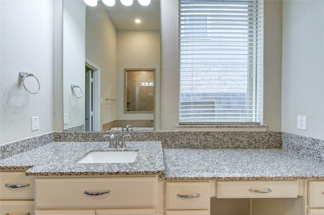 28418 Asher Falls Ln, Fulshear, TX 77441 - bathroom with vanity and a textured wall