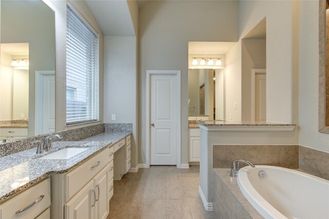 28418 Asher Falls Ln, Fulshear, TX 77441 - full bath with vanity, a bath, and healthy amount of natural light