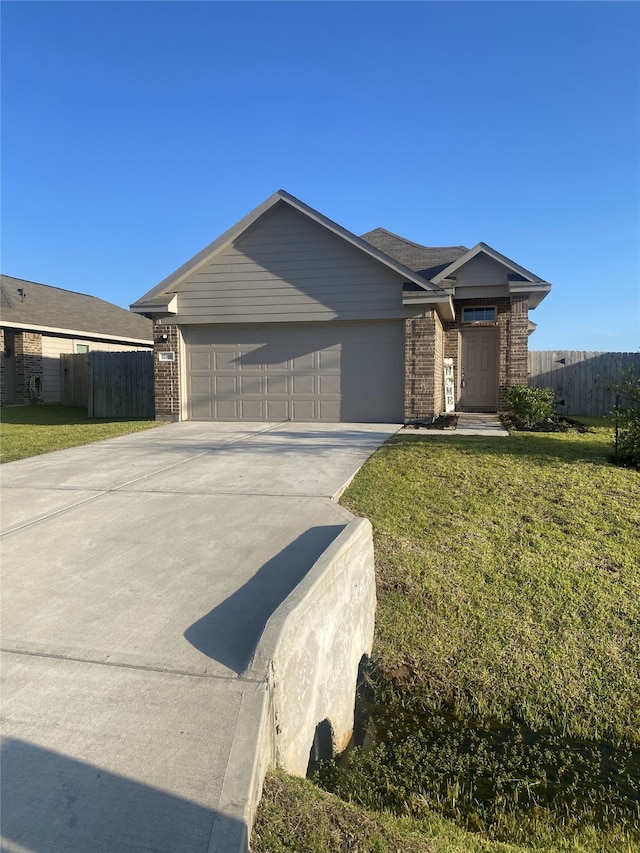 17768 Lionheart Rd, Conroe, TX 77306 - view of front of house with brick siding, driveway, and an attached garage