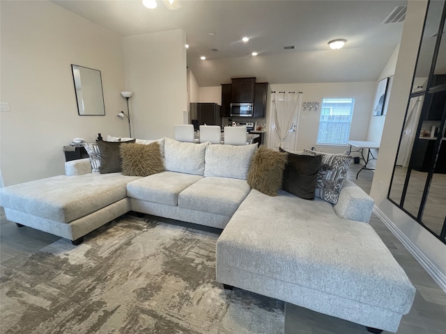 17768 Lionheart Rd, Conroe, TX 77306 - living room featuring lofted ceiling and baseboards