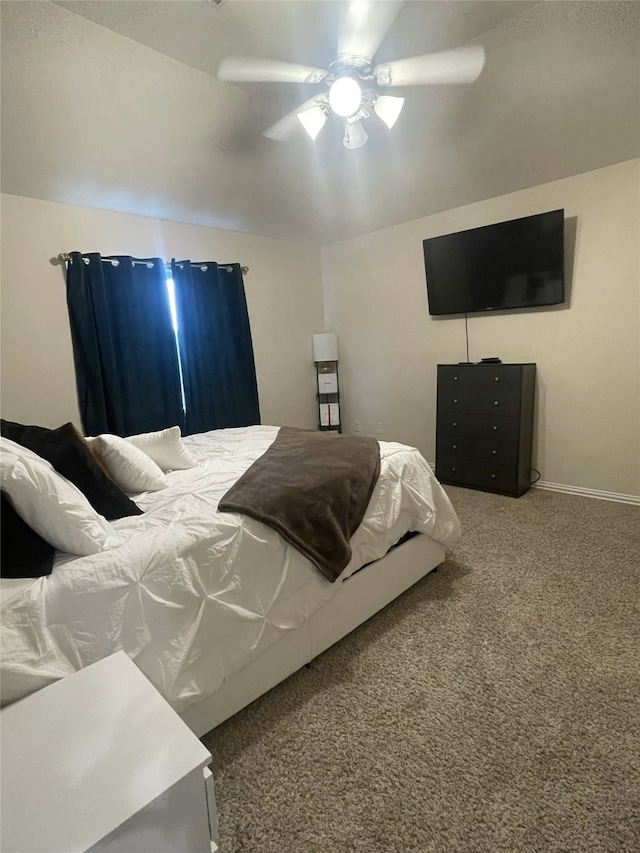 17768 Lionheart Rd, Conroe, TX 77306 - carpeted bedroom with ceiling fan and baseboards