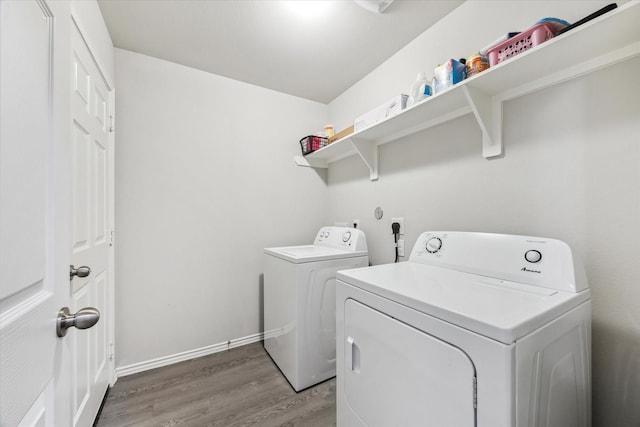 643 E Fairway Lake Dr, Alvin, TX 77511 - washroom featuring washer and clothes dryer, light wood-style flooring, and baseboards