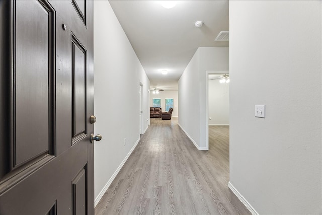 643 E Fairway Lake Dr, Alvin, TX 77511 - hall with light wood-type flooring and baseboards