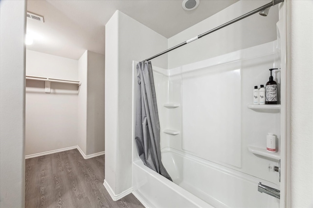 643 E Fairway Lake Dr, Alvin, TX 77511 - full bathroom with shower / bathtub combination with curtain, wood finished floors, and baseboards