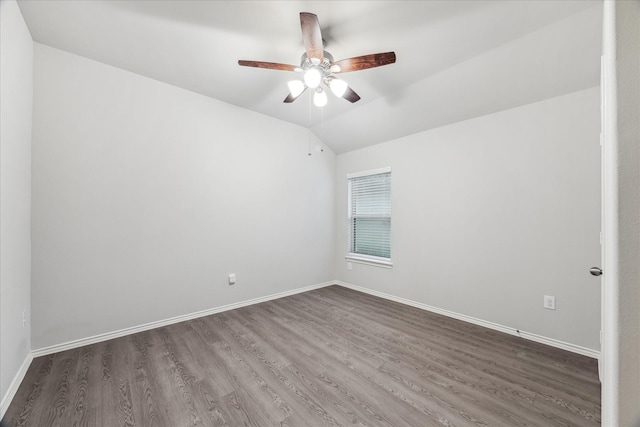 643 E Fairway Lake Dr, Alvin, TX 77511 - empty room with wood finished floors, ceiling fan, lofted ceiling, and baseboards