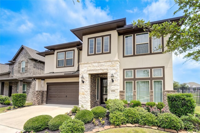 11702 Twin Creeks Hill Dr, Cypress, TX 77433 - view of front facade featuring stucco siding, driveway, and a garage
