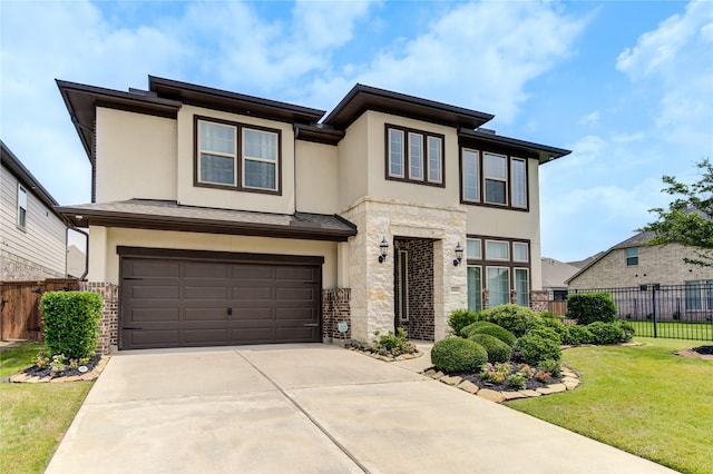 11702 Twin Creeks Hill Dr, Cypress, TX 77433 - view of front facade with stucco siding, an attached garage, stone siding, and concrete driveway