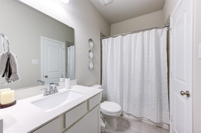 11702 Twin Creeks Hill Dr, Cypress, TX 77433 - bathroom featuring vanity, toilet, tile patterned floors, a textured wall, and a shower with curtain