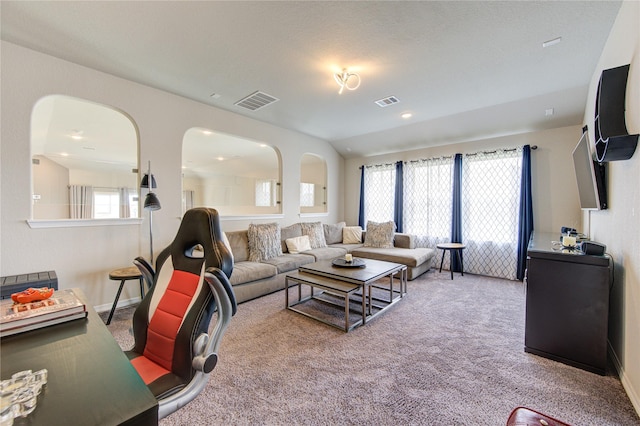 11702 Twin Creeks Hill Dr, Cypress, TX 77433 - carpeted living room featuring healthy amount of natural light, arched walkways, and baseboards