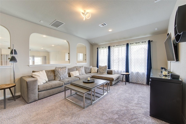 11702 Twin Creeks Hill Dr, Cypress, TX 77433 - carpeted living room featuring healthy amount of natural light, arched walkways, and lofted ceiling