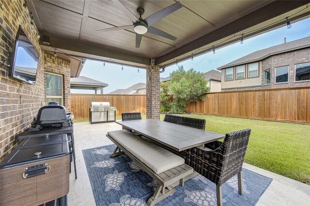 11702 Twin Creeks Hill Dr, Cypress, TX 77433 - view of patio / terrace with area for grilling, outdoor dining area, and a ceiling fan