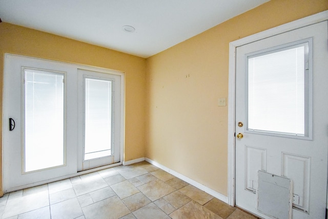 4721 Briarbend Dr, Houston, TX 77035 - doorway featuring healthy amount of natural light and baseboards