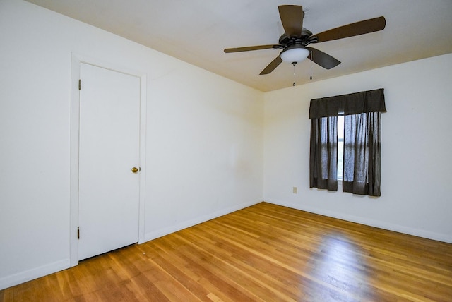 4721 Briarbend Dr, Houston, TX 77035 - unfurnished room with light wood-style floors, a ceiling fan, and baseboards