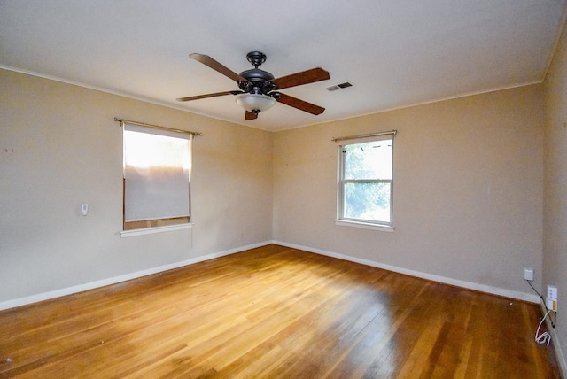 4721 Briarbend Dr, Houston, TX 77035 - empty room featuring wood finished floors, baseboards, a ceiling fan, and crown molding