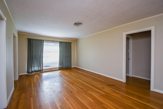 4721 Briarbend Dr, Houston, TX 77035 - unfurnished room featuring ornamental molding, wood finished floors, and baseboards
