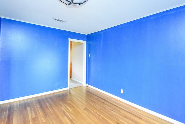 4721 Briarbend Dr, Houston, TX 77035 - spare room with baseboards, wood finished floors, and crown molding