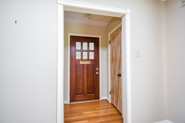 4721 Briarbend Dr, Houston, TX 77035 - doorway with light wood-style floors and baseboards