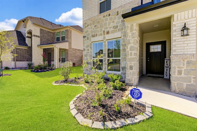 21430 Costalinda Dr, Cypress, TX 77433 - entrance to property featuring stone siding, a lawn, and brick siding