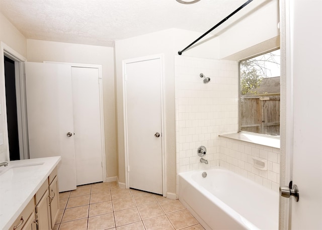 194 Moonridge Dr, Houston, TX 77015 - bathroom featuring tile patterned floors, vanity, bathtub / shower combination, and a textured ceiling