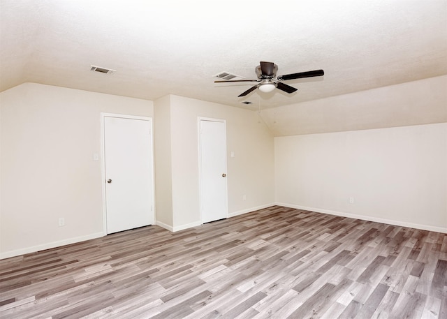 194 Moonridge Dr, Houston, TX 77015 - additional living space featuring vaulted ceiling, a ceiling fan, light wood-type flooring, baseboards, and a textured ceiling