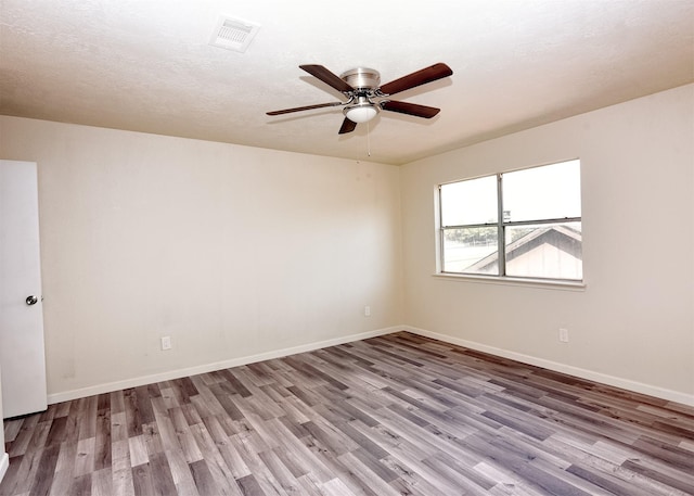 194 Moonridge Dr, Houston, TX 77015 - unfurnished room featuring wood finished floors, ceiling fan, and baseboards