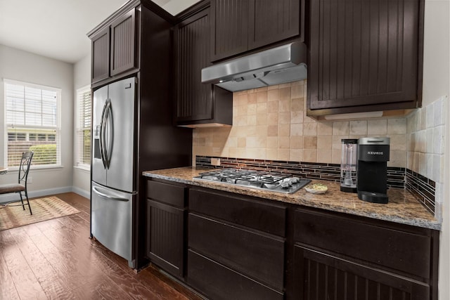 122 Cherry Oak Ln, Montgomery, TX 77316 - kitchen featuring stainless steel appliances, under cabinet range hood, and dark brown cabinets