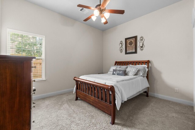 122 Cherry Oak Ln, Montgomery, TX 77316 - bedroom with carpet, baseboards, and ceiling fan