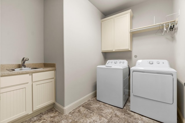 122 Cherry Oak Ln, Montgomery, TX 77316 - laundry area featuring independent washer and dryer, cabinet space, and baseboards